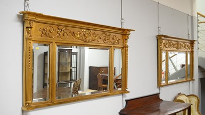 Lot 88 - A pair of ornate Regency-style gold-painted overmantel mirrors.