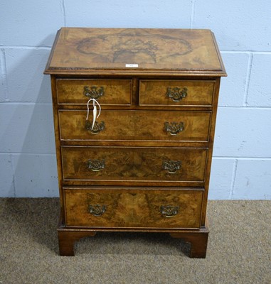 Lot 55 - A small 18th Century style burr walnut chest.