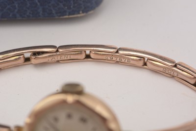 Lot 126 - A 9ct yellow gold bangle, and a 9ct yellow gold cocktail watch