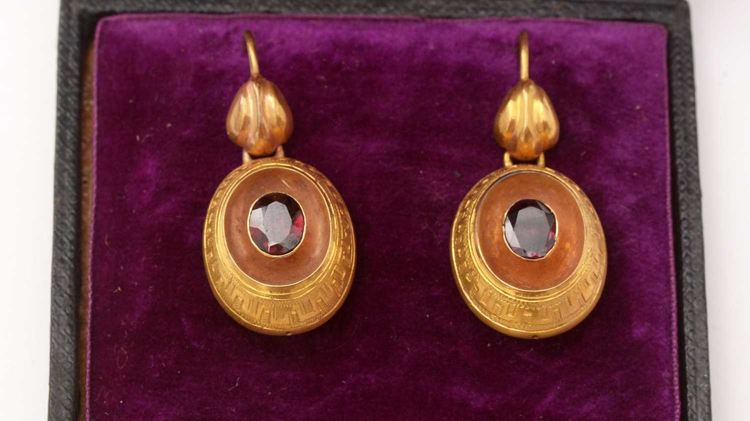 Lot 128 - A pair of Victorian gold and garnet earrings