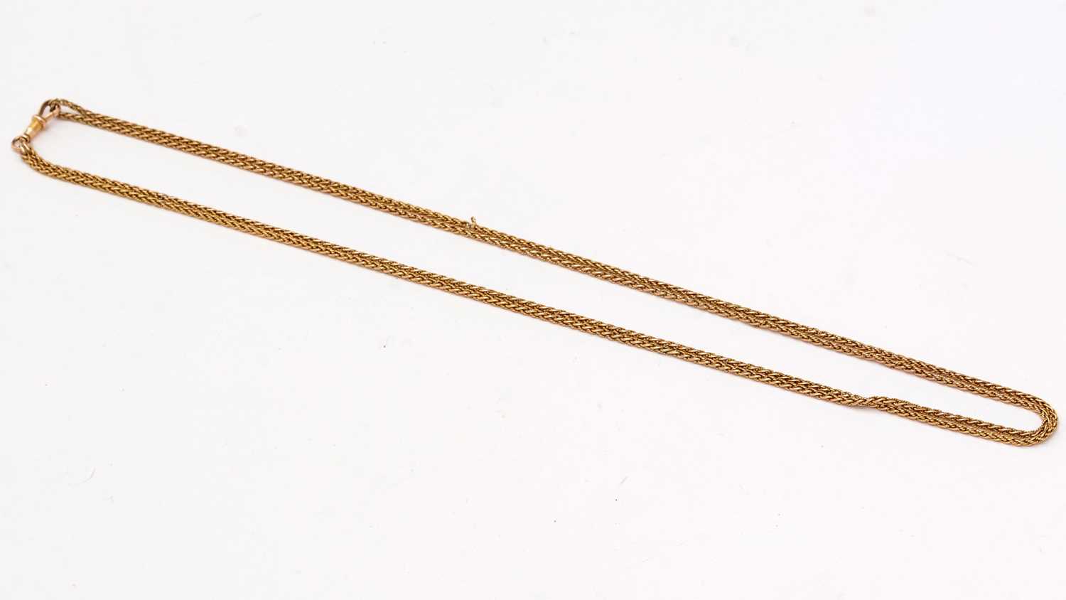 Lot 151 - A gold muff chain, of twist links