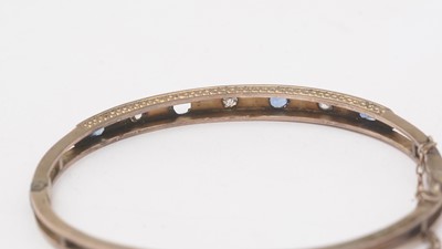 Lot 160 - A sapphire and diamond bangle
