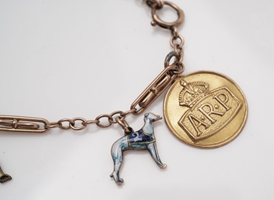 Lot 415 - A 9ct yellow gold and enamel charm bracelet