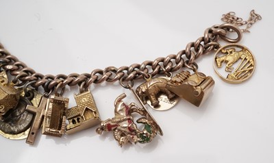 Lot 414 - A gold charm bracelet