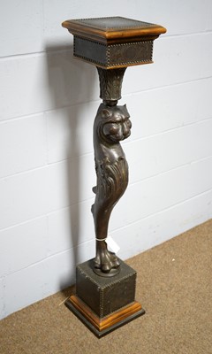Lot 48 - A designer bronzed and hardwood pedestal.