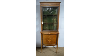 Lot 48 - An Edwardian inlaid mahogany and satinwood banded cabinet-on-stand.