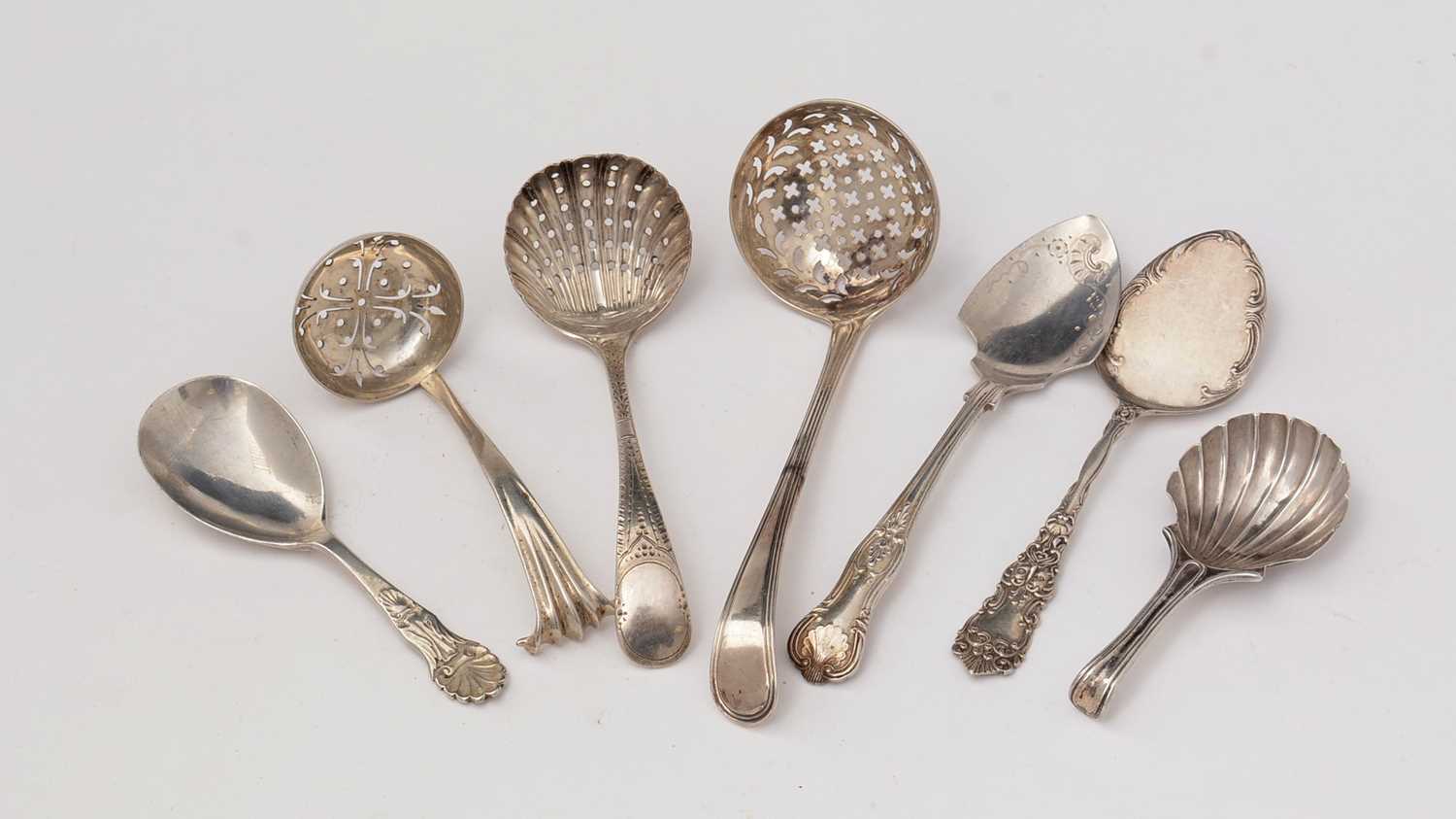 Lot 190 - Silver sugar sifters, tartlet slices and caddy spoons