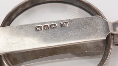 Lot 195 - A silver eyeglass, table seal, hair pins and bangle.