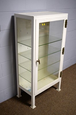 Lot 24 - A vintage white-painted metal surgical instrument display cabinet.