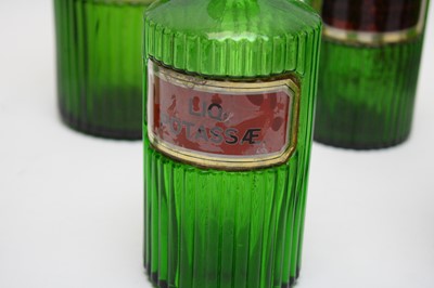 Lot 301 - A collection of green glass apothecary bottles.