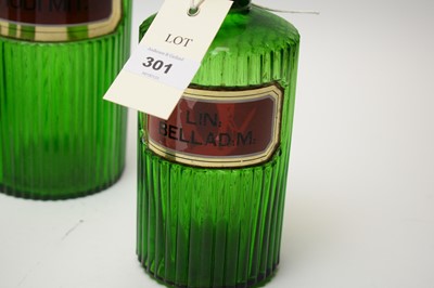 Lot 301 - A collection of green glass apothecary bottles.