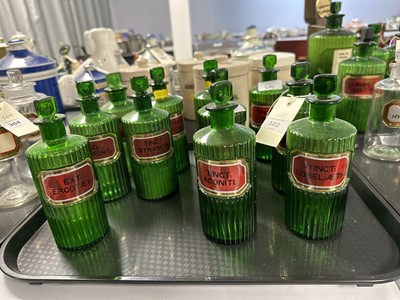 Lot 302 - A collection of green glass apothecary bottles.