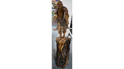 Lot 311 - A Chinese carved root wood figure.