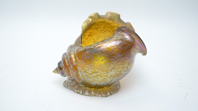 Lot 399 - An iridescent glass conch shell comport.