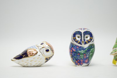 Lot 401 - A collection of three Royal Crown Derby ceramic owl paperweights.