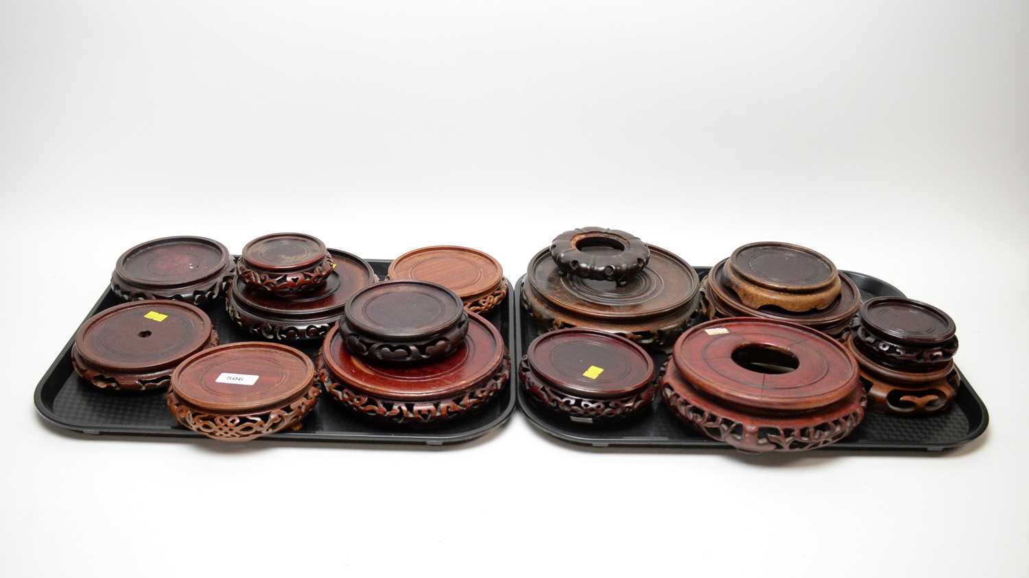 Lot 506 - A selection of Chinese carved and stained hardwood circular stands.