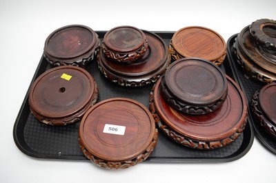 Lot 506 - A selection of Chinese carved and stained hardwood circular stands.