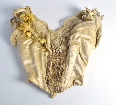 Lot 205 - An 1880s champagne silk evening bodice