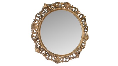 Lot 1079 - An ornate Italian-style giltwood mirror.