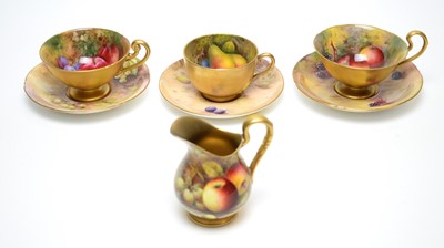 Lot 892 - Three fruit painted Worcester teacups and saucers and a jug