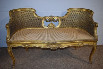 Lot 26 - A Louise XV-style bergere conversation settee; and a similarly styled armchair.