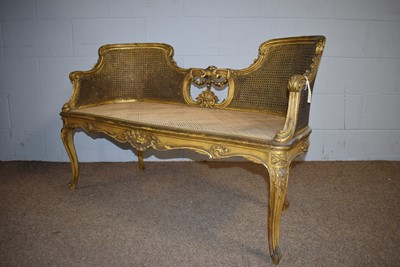 Lot 26 - A Louise XV-style bergere conversation settee; and a similarly styled armchair.