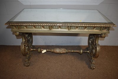 Lot 27 - An ornate silver-painted Italian-style side table.