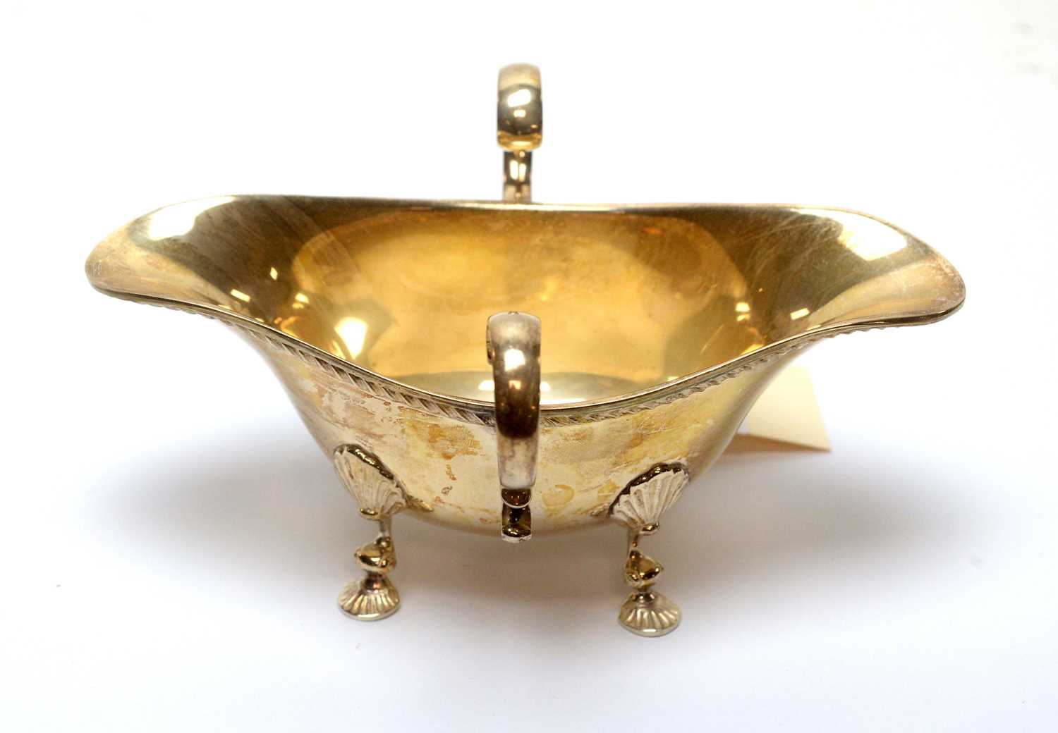 Lot 151 - A silver twin-handled sauce boat