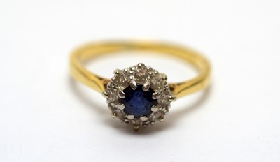 Lot 174 - A sapphire and diamond cluster ring and another ring