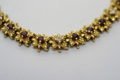 Lot 176 - An 18ct yellow gold bracelet set with rubies and diamonds