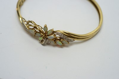 Lot 191 - An opal, diamond and 9ct yellow gold bangle
