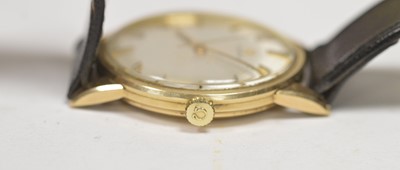 Lot 422 - Omega: a 9ct yellow gold cased manual wind wristwatch, and boxes