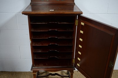 Lot 9 - An attractive Edwardian mahogany and satinwood banded music cabinet.
