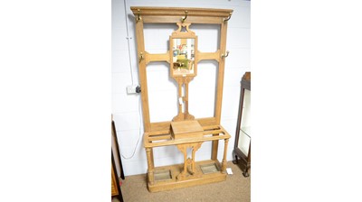 Lot 105 - An early 20th Century oak hall stand.