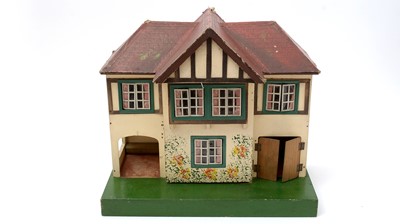 Lot 331 - An early 20th Century Tri-ang doll's house; and associated furniture.