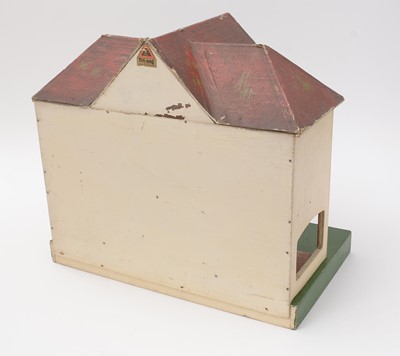Lot 331 - An early 20th Century Tri-ang doll's house; and associated furniture.