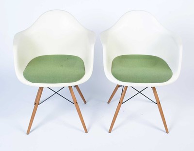 Lot 34 - Vitra after a design by Charles and Ray Eames: a pair of white plastic chairs.