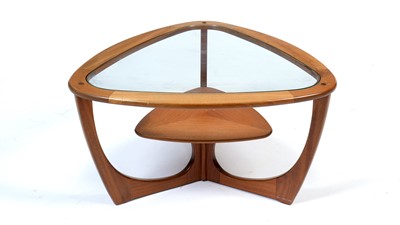 Lot 17 - A mid Century teak and glass top coffee table.