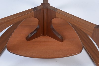 Lot 17 - A mid Century teak and glass top coffee table.