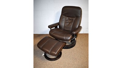 Lot 2 - Ekornes, Norway: brown leather 'Stressless' style reclining armchair and matching stool.