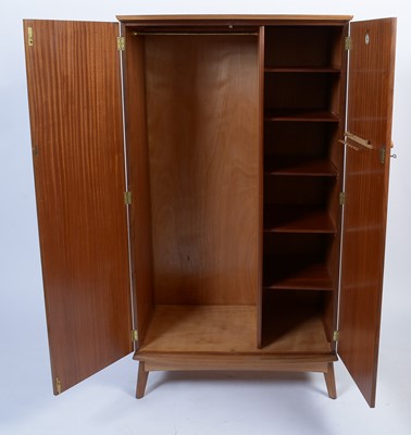 Lot 25 - Alfred Cox for A.C. Furniture: a mid Century teak and walnut bedroom suite.
