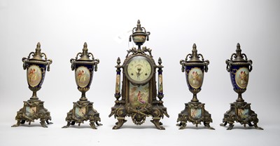 Lot 427 - An early 20th Century German clock garniture.