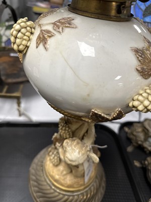 Lot 429 - A Victorian brass and porcelain oil lamp.