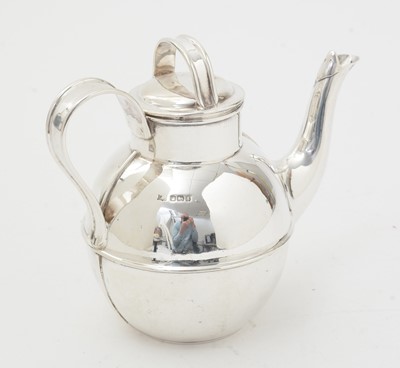 Lot 137 - A George V silver bachelor's or afternoon teapot.