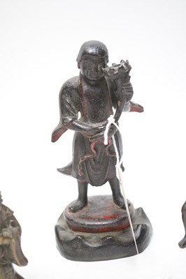 Lot 408 - A selection of oriental figures.