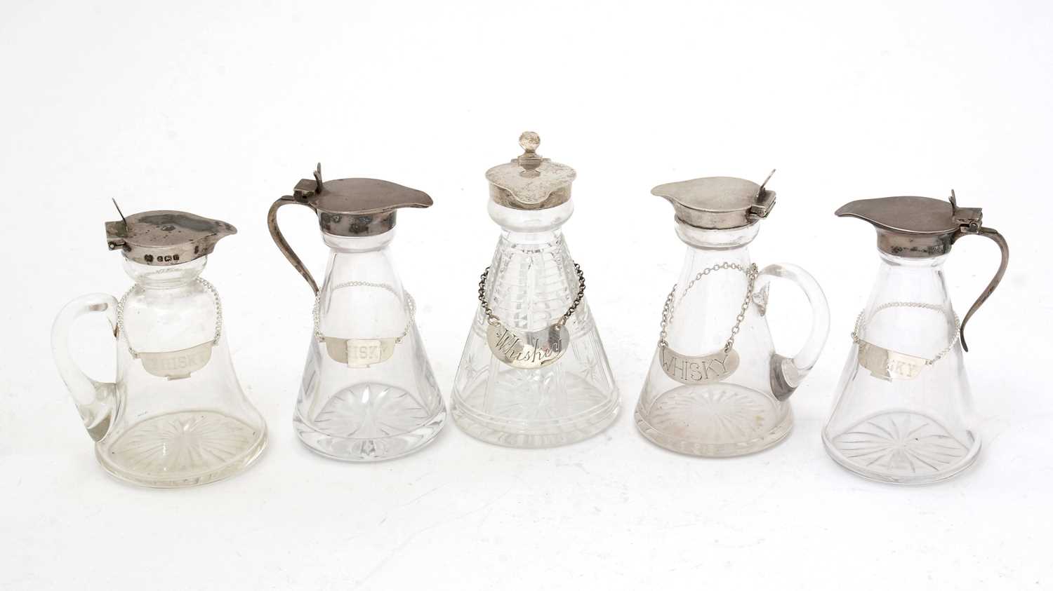 Lot 170 - Five various silver-mounted cut glass whisky tots/chota pegs; and five various labels.