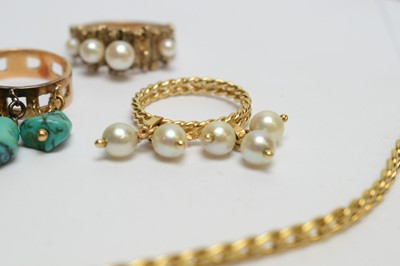 Lot 194 - Two tasse rings, another ring and a gilt metal chain.