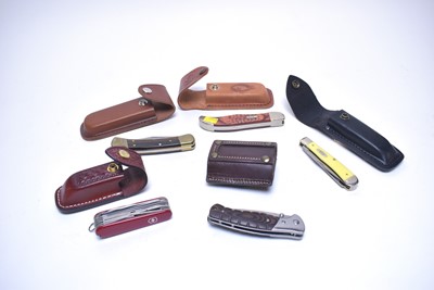 Lot 271 - A selection of knives, including: Case & Sons knife; and others, most by Buck; replica lighter.