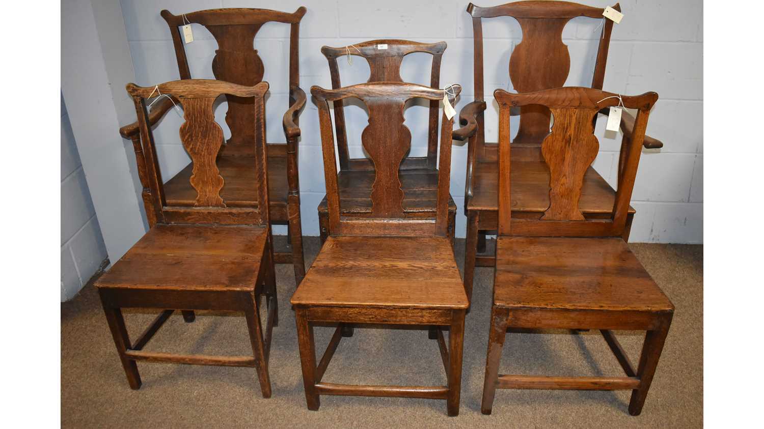 Lot 67 - Six matched rustic oak solid seat dining chairs.