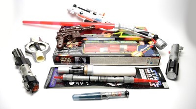 Lot 213 - A selection of boxed and unboxed lightsabers and other weapons.